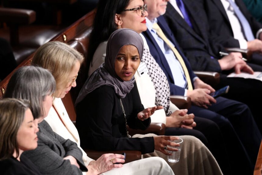 ilhan omar guest arrested for standing at trumps state of the union address 699f4ba583afb