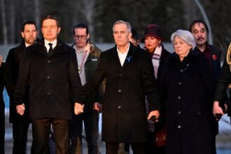 mark carney joins hands with canada opposition leader as he pays tribute to school shooting victims 69900bb73e849